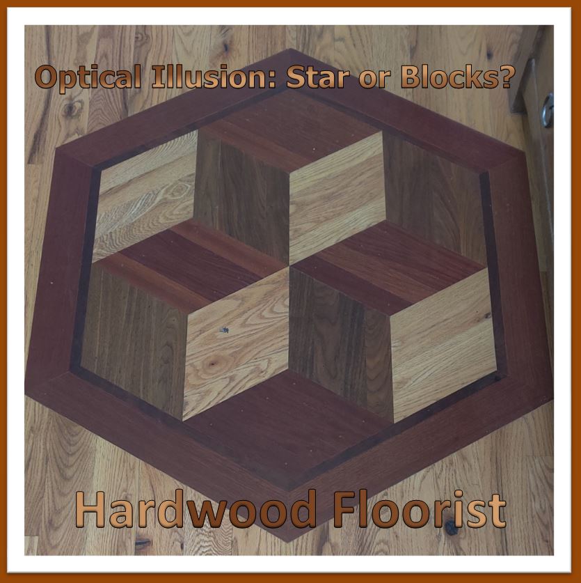 a hardwood medallion made from Brazilian cherry, walnut, and red oak by Hardwood Floorist. It pictures an optical illusion that can be seen as both a star or stacked blocks.
